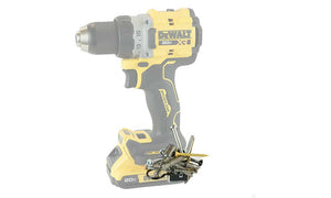 A yellow and black DeWalt 20V XR drill equipped with a Second Set Magnet on its belt hook, securely holding an assortment of screws and hardware, showcasing the magnet's strength and convenience for DIY and professional projects.